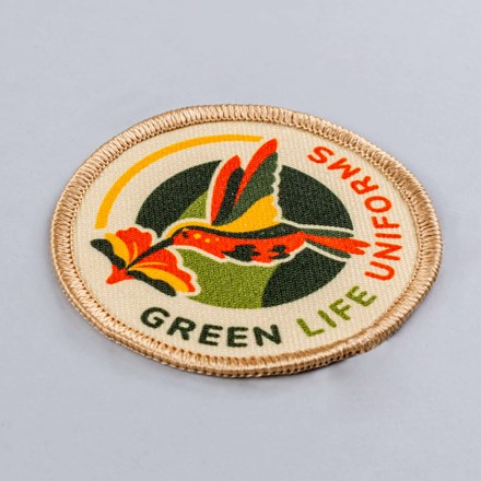 Sublimated Green Life Uniforms patch laid at a hard angle